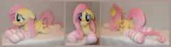 Size: 4572x1264 | Tagged: safe, artist:calusariac, derpibooru import, fluttershy, pony, blushing, clothes, image, irl, jpeg, lying down, photo, plushie, prone, socks, solo, striped socks