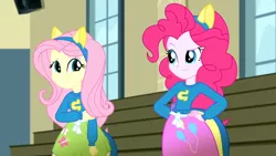 Size: 3410x1920 | Tagged: safe, derpibooru import, screencap, fluttershy, pinkie pie, eqg summertime shorts, equestria girls, steps of pep, clothes, cutie mark, cutie mark on clothes, duo, duo female, female, hand on hip, high res, image, jpeg, looking at each other, looking at someone, smiling, smiling at each other, wondercolts uniform