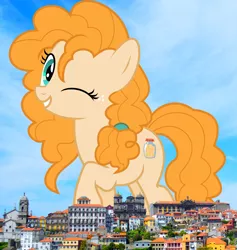 Size: 2658x2808 | Tagged: safe, artist:jhayarr23, artist:thegiantponyfan, derpibooru import, pear butter, earth pony, pony, female, giant pony, giant/macro earth pony, giantess, grin, high res, highrise ponies, image, irl, jpeg, looking at you, macro, mare, mega giant, one eye closed, photo, ponies in real life, portugal, smiling, solo, wink
