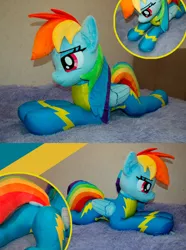 Size: 1280x1718 | Tagged: safe, artist:lanacraft, derpibooru import, rainbow dash, pegasus, pony, butt, clothes, commission, g4, image, irl, jpeg, lidded eyes, lying down, photo, plushie, prone, skintight clothes, smiling, solo, uniform, wings, wonderbolts uniform