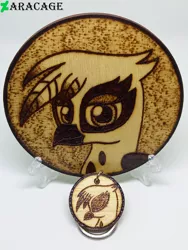 Size: 3000x4000 | Tagged: safe, artist:aracage, derpibooru import, gilda, gryphon, bust, coaster, eyes closed, image, irl, jpeg, keychain, looking at you, photo, portrait, profile, pyrography, traditional art