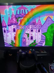 Size: 3000x4000 | Tagged: safe, derpibooru import, puzzlemint, castle, celebration castle, controller, g3, image, jpeg, photo, picture of a screen, rainbow, television, text, video game