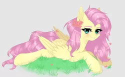 Size: 1280x787 | Tagged: safe, artist:sufflle, derpibooru import, fluttershy, pegasus, pony, aside glance, beige background, cheek fluff, ear fluff, female, flower, flower in hair, grass, grin, image, looking at you, lying down, mare, png, prone, sideways glance, simple background, smiling, solo, wings