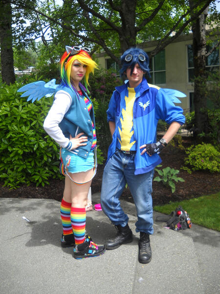 Size: 2121x2828 | Tagged: safe, artist:arcticshadowfox, derpibooru import, rainbow dash, soarin', human, clothes, cosplay, costume, duo, everfree northwest, everfree northwest 2015, goggles, hand on hip, high res, image, irl, irl human, jpeg, multicolored hair, photo, rainbow hair, rainbow socks, socks, striped socks