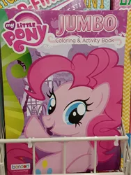 Size: 3000x4000 | Tagged: safe, derpibooru import, pinkie pie, earth pony, pony, coloring book, dollar tree, error, female, high res, image, irl, jpeg, mare, my little pony jumbo coloring book, my little pony logo, open mouth, open smile, photo, raised hoof, smiling, solo