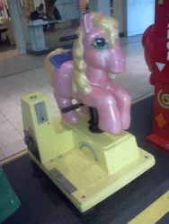 Size: 240x320 | Tagged: safe, derpibooru import, starlight (g1), earth pony, pony, my little pony tales, blue bow, bow, clifford the big red dog, cute, female, g1, green eyes, image, jpeg, kiddie ride, livingston mall, mall, mare, picture for breezies, shopping mall, solo, stawwlight, tail, tail bow, yellow hair, yellow mane, yellow tail
