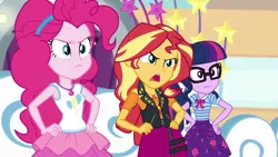 Size: 1920x1080 | Tagged: safe, derpibooru import, screencap, pinkie pie, sci-twi, sunset shimmer, twilight sparkle, equestria girls, equestria girls series, rollercoaster of friendship, clothes, female, hand on hip, image, open mouth, pinkie pie is not amused, png, skirt, sunset shimmer is not amused, talking, trio, trio female, tutu, twilight sparkle is not amused, unamused
