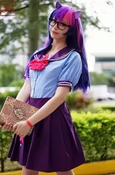 Size: 711x1080 | Tagged: safe, artist:flutterbutter cosplay, derpibooru import, twilight sparkle, human, book, book of harmony, clothes, cosplay, costume, glasses, image, irl, irl human, jpeg, photo