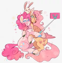 Size: 1280x1289 | Tagged: safe, artist:wanderingpegasus, derpibooru import, angel bunny, fluttershy, pinkie pie, earth pony, pegasus, pony, rabbit, animal, chest fluff, cute, diapinkes, duo, female, freckles, grin, heart, hug, image, jpeg, leg fluff, male, mare, markings, mobile phone, phone, redesign, selfie, selfie stick, shyabetes, simple background, smartphone, smiling, twitterina design, unshorn fetlocks, white background