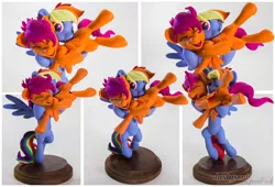 Size: 2970x2020 | Tagged: safe, artist:dustysculptures, derpibooru import, rainbow dash, scootaloo, pegasus, pony, craft, duo, image, jpeg, laughing, older, older scootaloo, raspberry, sculpture, tongue out, tummy buzz