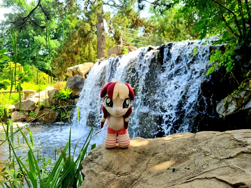 Size: 4032x3024 | Tagged: safe, artist:xeto_de, derpibooru import, oc, oc:vanilla cream, original species, plush pony, pony, g4, image, irl, jpeg, nature, photo, plushie, realistic, water, waterfall