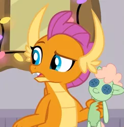 Size: 537x553 | Tagged: safe, derpibooru import, screencap, smolder, dragon, the hearth's warming club, cropped, doll, dragoness, female, image, png, raised eyebrow, solo, toy