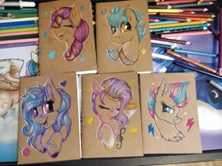 Size: 1920x1440 | Tagged: safe, artist:julunis14, derpibooru import, hitch trailblazer, izzy moonbow, pipp petals, sunny starscout, zipp storm, earth pony, pegasus, pony, unicorn, colored pencil drawing, eyes closed, g5, image, jpeg, notebook, photo, singing, smug, traditional art, unshorn fetlocks