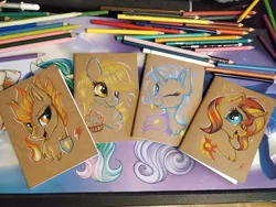 Size: 1152x864 | Tagged: safe, artist:julunis14, derpibooru import, derpy hooves, spitfire, sunset shimmer, trixie, pegasus, pony, unicorn, :p, bubble, bust, cape, clothes, colored pencil drawing, cutie mark, fire, food, image, jpeg, muffin, notebook, one eye closed, portrait, tongue out, traditional art, wink