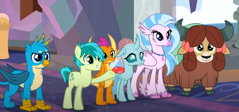 Size: 1000x471 | Tagged: safe, derpibooru import, screencap, gallus, ocellus, sandbar, silverstream, smolder, yona, changedling, changeling, classical hippogriff, dragon, earth pony, gryphon, hippogriff, pony, yak, uprooted, bow, cloven hooves, colored hooves, cropped, cute, diaocelles, diastreamies, gallabetes, hair bow, image, jewelry, monkey swings, necklace, png, raised hoof, sandabetes, smolderbetes, student six, yonadorable