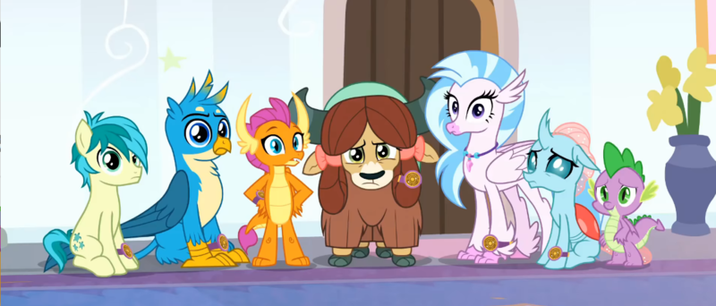 Size: 1194x510 | Tagged: safe, derpibooru import, screencap, gallus, ocellus, sandbar, silverstream, smolder, spike, yona, changedling, changeling, classical hippogriff, dragon, earth pony, gryphon, hippogriff, pony, yak, a matter of principals, bow, cloven hooves, colored hooves, confused, cropped, hair bow, hand on hip, image, jewelry, looking at you, monkey swings, necklace, png, reaction image, student six