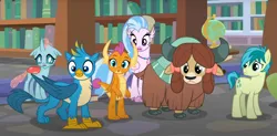 Size: 1502x738 | Tagged: safe, derpibooru import, screencap, gallus, ocellus, sandbar, silverstream, smolder, yona, changedling, changeling, classical hippogriff, dragon, earth pony, gryphon, hippogriff, pony, yak, what lies beneath, bookshelf, bow, cloven hooves, cropped, dragoness, female, globe, hair bow, image, jewelry, monkey swings, necklace, offscreen character, png, student six
