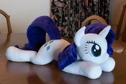 Size: 5184x3456 | Tagged: safe, artist:azgchip, derpibooru import, rarity, pony, unicorn, female, image, irl, lying down, mare, photo, plushie, png, prone, solo, table