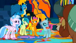 Size: 1600x900 | Tagged: safe, derpibooru import, screencap, gallus, ocellus, sandbar, silverstream, smolder, yona, changedling, changeling, classical hippogriff, dragon, earth pony, gryphon, hippogriff, pony, yak, uprooted, bow, colored hooves, crossed arms, dragoness, female, hair bow, image, jewelry, male, monkey sings, necklace, paint, png, sapling, student six