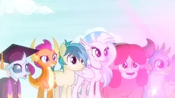 Size: 1600x898 | Tagged: safe, derpibooru import, screencap, gallus, ocellus, sandbar, silverstream, smolder, yona, changedling, changeling, classical hippogriff, dragon, earth pony, gryphon, hippogriff, pony, yak, uprooted, bow, clothes, dragoness, female, glow, graduation cap, hair bow, hat, image, jewelry, male, monkey swings, necklace, png, raised eyebrow, robe, student six