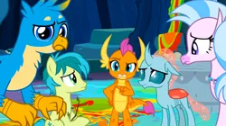 Size: 1600x898 | Tagged: safe, derpibooru import, screencap, gallus, ocellus, sandbar, silverstream, smolder, changedling, changeling, classical hippogriff, dragon, earth pony, gryphon, hippogriff, pony, uprooted, dragoness, female, image, jewelry, male, necklace, png, pointing, raised eyebrow, sapling