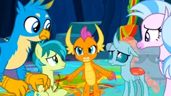 Size: 1600x899 | Tagged: safe, derpibooru import, screencap, gallus, ocellus, sandbar, silverstream, smolder, changedling, changeling, classical hippogriff, dragon, earth pony, gryphon, hippogriff, pony, uprooted, angry, dragoness, female, image, jewelry, male, necklace, png, sapling, spread arms