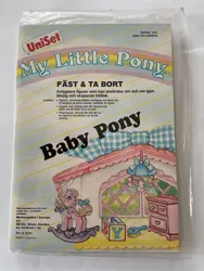 Size: 1536x2048 | Tagged: safe, derpibooru import, earth pony, pony, baby, baby pony, baby pony (g1), blue eyes, bow, brush, building blocks, crib mobile, dresser, female, filly, foal, g1, image, irl, jpeg, my little pony logo, photo, solo, sticker pack, swedish, tail, tail bow, toy, window