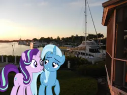Size: 2048x1536 | Tagged: safe, artist:charity-rose, artist:jaredking779, derpibooru import, starlight glimmer, trixie, pony, unicorn, bedroom eyes, boat, duo, female, florida, fort myers, image, irl, jpeg, lidded eyes, mare, photo, ponies in real life, raised hoof, river, ship, smiling, water