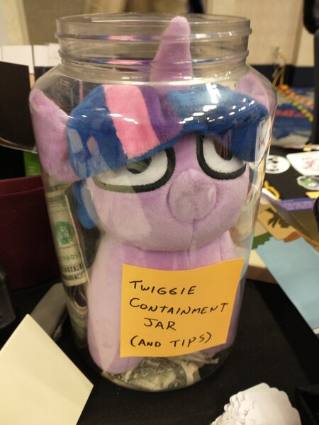 Size: 3072x4096 | Tagged: safe, artist:jargon scott, derpibooru import, twilight sparkle, pony, unicorn, female, filly, filly twilight sparkle, image, irl, jar, jpeg, mare fair, mare fair 2023, photo, plushie, snowpity inc., solo, squatpony, tip jar, twiggie, unicorn twilight, younger