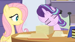 Size: 1280x720 | Tagged: safe, artist:agrol, derpibooru import, fluttershy, starlight glimmer, book, cute, glimmerbetes, image, pencil, png, quill, school of friendship, sleeping, stack of papers, the element of kindness