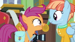 Size: 1280x720 | Tagged: safe, derpibooru import, screencap, scootaloo, windy whistles, pegasus, pony, parental glideance, bag, camera, cute, cutealoo, female, filly, foal, freckles, image, looking at each other, looking at someone, mare, open mouth, open smile, png, saddle bag, smiling, smiling at each other, windybetes