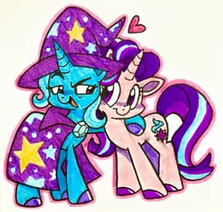 Size: 2048x1949 | Tagged: safe, artist:raystarkitty, derpibooru import, starlight glimmer, trixie, cape, clothes, duo, duo female, female, hat, heart, horn, hug, image, jpeg, lesbian, looking at each other, looking at someone, marker drawing, shipping, smiling, stars, startrix, traditional art, trixie's cape, trixie's hat