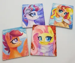 Size: 1204x1000 | Tagged: safe, artist:maytee, derpibooru import, fluttershy, scootaloo, sunset shimmer, zipp storm, pegasus, pony, unicorn, g5, bust, clothes, coffee, coffee cup, cup, headphones, image, jpeg, magnet, portrait, scarf, spread wings, traditional art, watercolor painting, wings