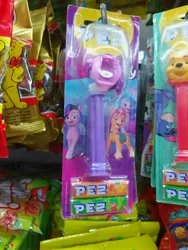 Size: 3000x4000 | Tagged: safe, derpibooru import, izzy moonbow, pipp petals, sunny starscout, g5, spoiler:g5, decapitated, decapitation, dispenser, eeyore, food, haribo, image, jpeg, ouch, pez, winnie the pooh, you had one job