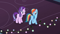 Size: 710x400 | Tagged: safe, derpibooru import, screencap, rainbow dash, starlight glimmer, pegasus, pony, unicorn, a hearth's warming tail, season 6, animated, christmas, christmas lights, duo, duo female, female, flapping wings, flying, folded wings, g4, gif, grin, holiday, image, mare, mouth hold, open mouth, open smile, smiling, spread wings, string lights, wings