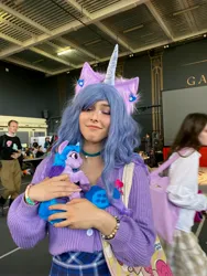 Size: 3024x4032 | Tagged: safe, artist:hysteriana, derpibooru import, izzy moonbow, human, original species, plush pony, pony, g5, blue hair, brony, choker, clothes, cosplay, costume, ear fluff, ear piercing, female, festival, hug, image, irl, irl human, jewelry, jpeg, nail polish, nails, nature, photo, piercing, plushie, skirt, smiling, solo, sweater, toy