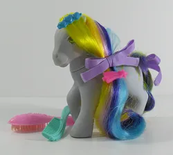 Size: 674x600 | Tagged: safe, derpibooru import, earth pony, pony, barrette, bow, brush, brush 'n grow ponies, comb, female, g1, hair bow, image, irl, jpeg, mane, mare, photo, raised hoof, ringlets (g1), smiling, tail, tail bow, toy