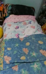 Size: 2000x3200 | Tagged: safe, derpibooru import, izzy moonbow, sunny starscout, zipp storm, my little pony: a new generation, bed, bedsheets, cutie mark, g5, image, jpeg, quilt