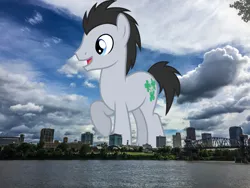Size: 1080x810 | Tagged: safe, artist:dashiesparkle, derpibooru import, edit, editor:jaredking779, lucky clover, earth pony, pony, arkansas, background pony, giant pony, giant/macro earth pony, highrise ponies, image, irl, jpeg, little rock, macro, male, mega giant, open mouth, photo, ponies in real life, raised hoof, smiling, solo, stallion