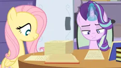 Size: 1280x721 | Tagged: safe, artist:agrol, derpibooru import, fluttershy, starlight glimmer, book, image, paperwork, pencil, png, quill, school of friendship, the element of kindness