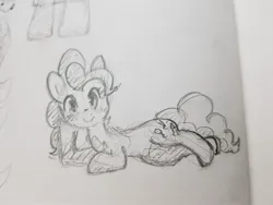 Size: 1896x1422 | Tagged: safe, artist:fipoki, derpibooru import, pinkie pie, earth pony, pony, female, grayscale, image, jpeg, looking at you, lying down, mare, monochrome, side, simple background, smiling, solo, traditional art, white background