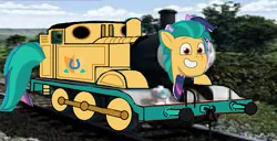 Size: 981x504 | Tagged: safe, artist:allahdaad, derpibooru import, editor:allahdaad, hitch trailblazer, my little pony: tell your tale, 1000 years in photoshop, g5, image, irl, photo, png, thomas and friends, train, wtf