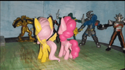 Size: 994x558 | Tagged: safe, derpibooru import, fluttershy, pinkie pie, earth pony, pegasus, pony, animated, goldar, image, mighty morphin power rangers, power rangers, stop motion, toy, webm