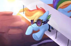 Size: 3517x2276 | Tagged: safe, artist:littleblackraencloud, derpibooru import, rainbow dash, earth pony, pony, artificial wings, augmented, clothes, determined, earth pony rainbow dash, flying, goggles, image, png, race swap, rock, sky, solo, sun, wings