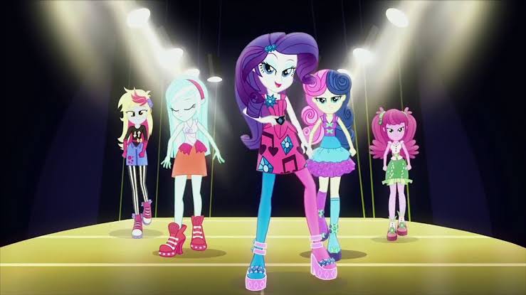 Size: 739x415 | Tagged: safe, derpibooru import, screencap, bon bon, cheerilee, derpy hooves, lyra heartstrings, rarity, sweetie drops, human, equestria girls, life is a runway, rainbow rocks, 4+, deviantart, for kids only, generosity, image, jpeg, lights, music video, profile, simple background