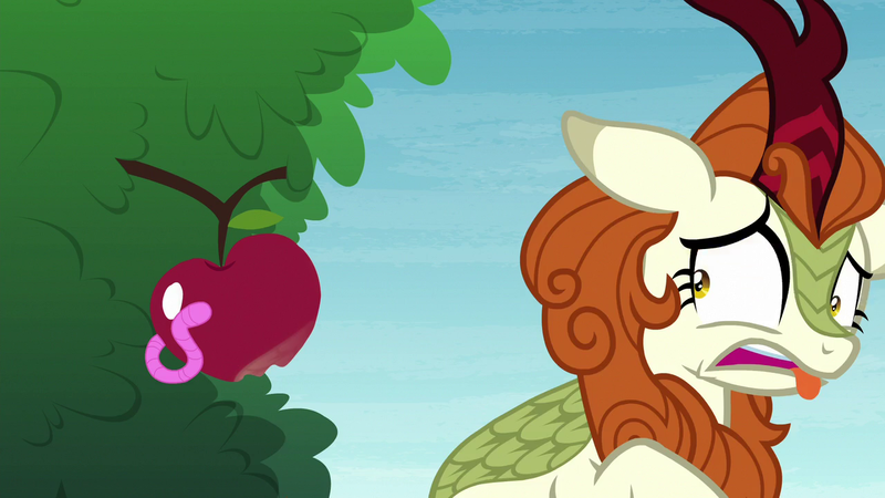 Size: 1280x720 | Tagged: safe, derpibooru import, screencap, autumn blaze, kirin, worm, sounds of silence, a kirin tale, apple, awwtumn blaze, cute, disgusted, eww, female, food, image, png, solo, tongue out, tree, worm in apple