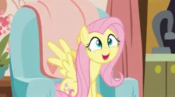 Size: 2129x1186 | Tagged: safe, derpibooru import, screencap, fluttershy, pegasus, pony, discordant harmony, chair, curtains, excited, female, happy, image, jpeg, kitchen, living room, mare, sat down, sink, solo, spread wings, wings