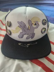 Size: 960x1280 | Tagged: safe, derpibooru import, derpy hooves, buttons, cap, death metal, hat, image, jpeg, merchandise, safety pin