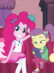 Size: 810x1080 | Tagged: safe, derpibooru import, lily pad (equestria girls), pinkie pie, equestria girls, equestria girls series, pinkie sitting, clothes, grin, image, jpeg, mobile phone, pantyhose, phone, smiling