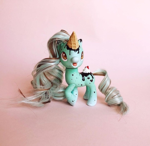 Size: 1080x1052 | Tagged: safe, artist:beccaintoyland, derpibooru import, pony, unicorn, my little pony: pony life, body markings, brown mane, chocolate, curly mane, curly tail, customized toy, facial markings, food, freckles, g4, green coat, ice cream, ice cream cone, ice cream horn, ice cream pony, image, irl, jpeg, mint, mint chocolate chip, multicolored mane, photo, repaint, speckled, tail, toy, white mane